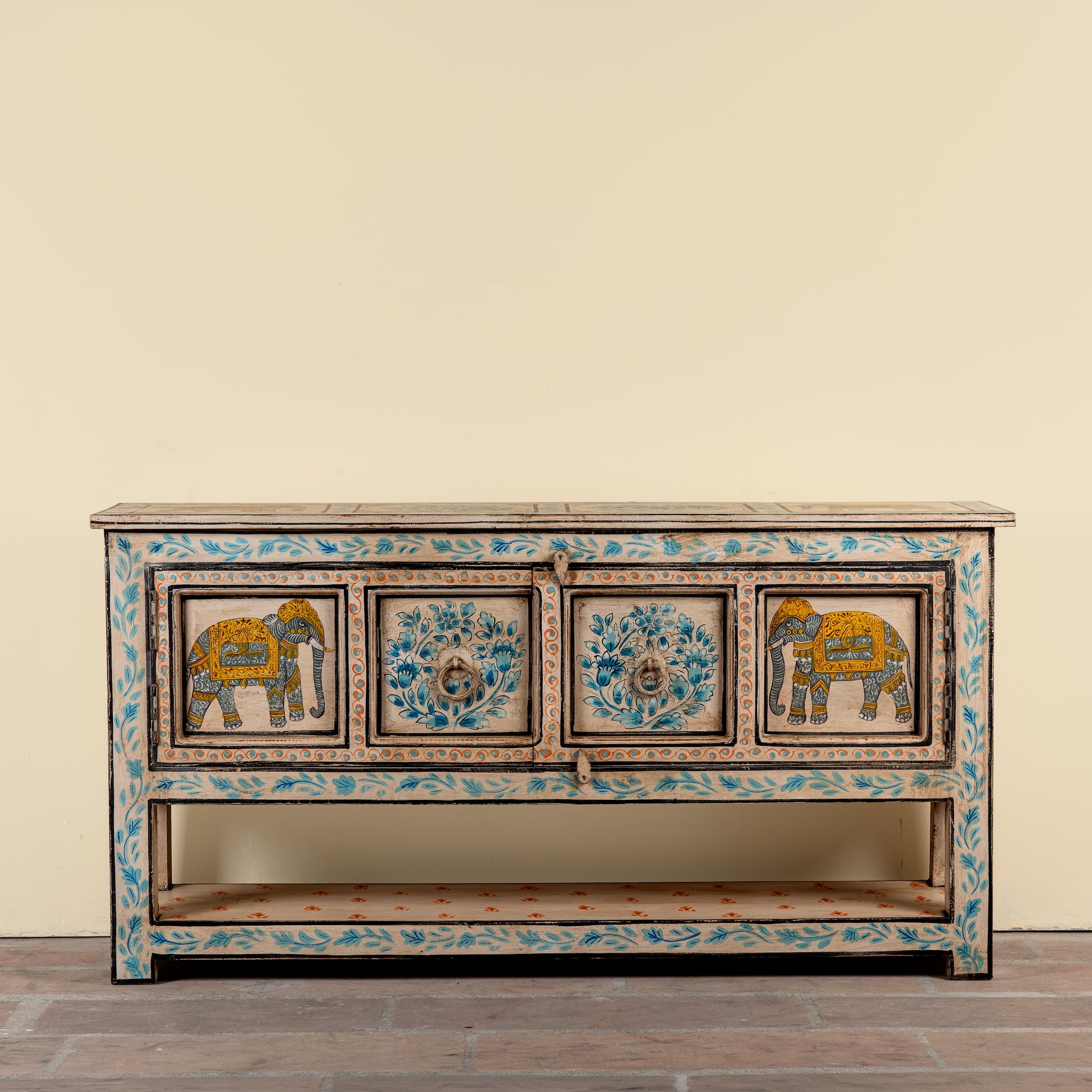 Aakash hand painted reclaimed wood console table with blue floral and elephant motifs, storage and open shelf 114cm