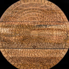 Close up image of a mandala carved wood chest with black frame and natural carved mango wood drawers, mango wood drawer chest for modern bohemian interiors, 120 × 47 × 110 cm.