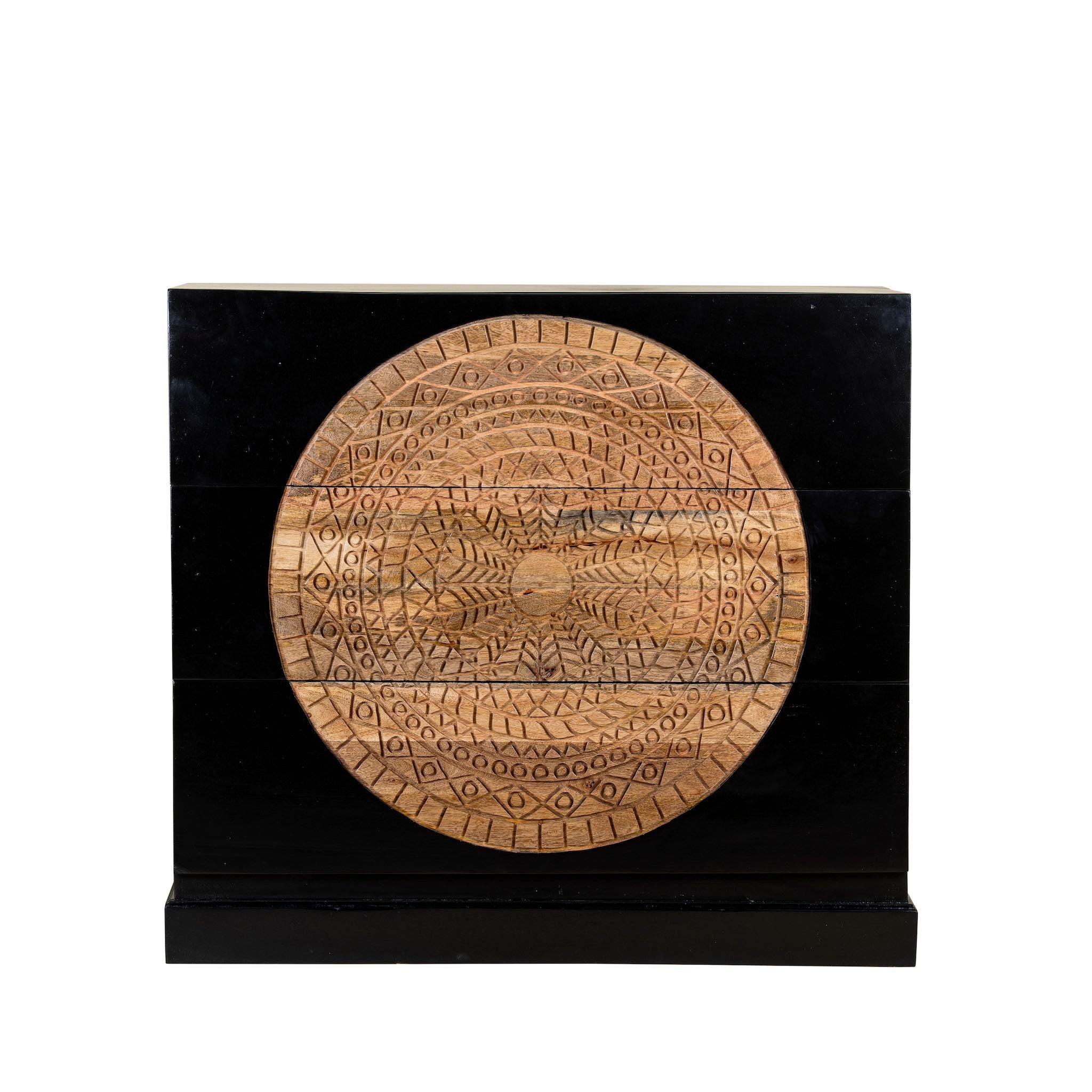 White background image of a mandala carved wood chest with black frame and natural carved mango wood drawers, mango wood drawer chest for modern bohemian interiors, 120 × 47 × 110 cm.