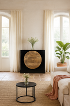 Lifestyle imagination of a mandala carved wood chest with black frame and natural carved mango wood drawers, mango wood drawer chest for modern bohemian interiors, 120 × 47 × 110 cm.