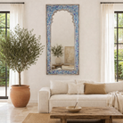 Living room with a large decorative mirror, Aalap made of reclaimed wood with arched top.
