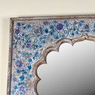 Close up image of a large decorative mirror, Aalap made of reclaimed wood with arched top.