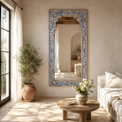 Living room with a large decorative mirror, Aalap made of reclaimed wood with arched top.