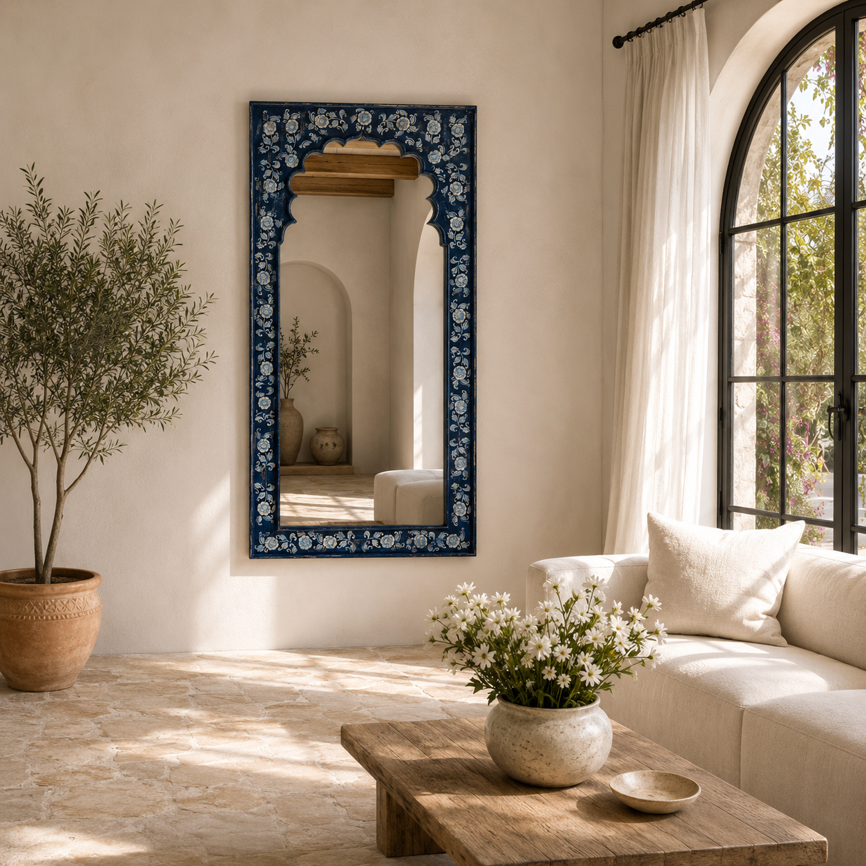 Lifestyle image of a unique hand painted Indian arch mirror made of reclaimed wood.