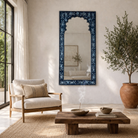 Lifestyle image of a unique hand painted Indian arch mirror made of reclaimed wood.