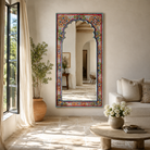 Lifestyle image of a uniquely hand painted Indian window arch mirror made of reclaimed wood in Boho style..