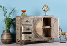 Open door image of a hand painted sideboard in blue and beige with rattan door inserts; unique furniture for boho style interiors, 120 × 40 × 92 cm.