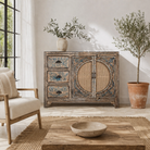 Life style image of a hand painted sideboard in blue and beige with rattan door inserts; unique furniture for boho style interiors, 120 × 40 × 92 cm.
