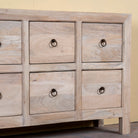 Close up image of a sandblasted reclaimed mango wood chest of drawers with ten drawers, perfect as bedroom furniture or part of a relaxed Ibiza-style interior.