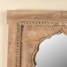 Close up image of a Aarshan reclaimed teak wood mirror made from an old Indian carved window frame with arched design, 84x120cm