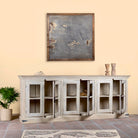 Open door image of a sandblasted reclaimed wood sideboard in Ibiza style with four glass-panelled doors, vintage Mediterranean furniture, 263×45×100 cm.