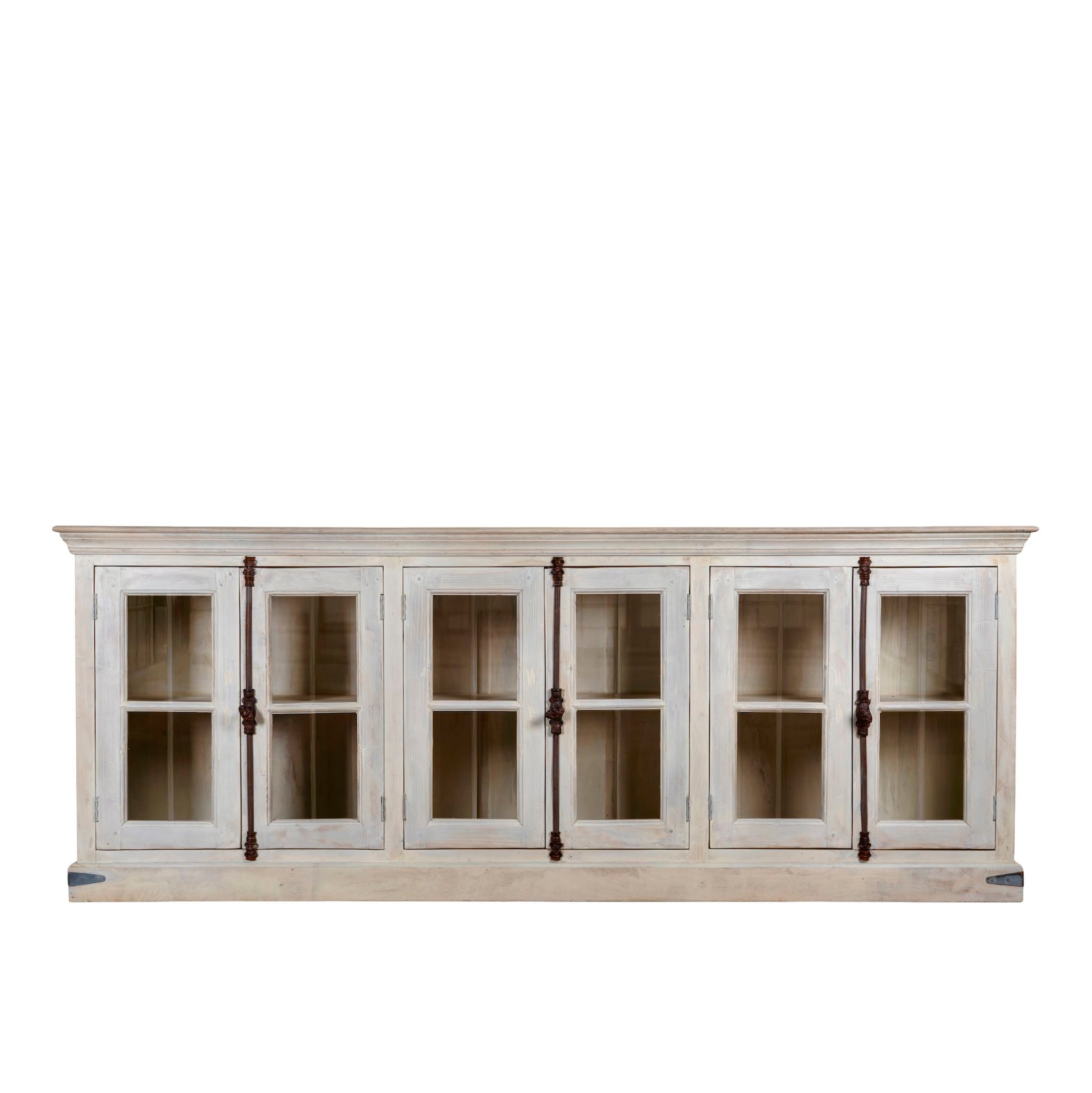 White background image of a sandblasted reclaimed wood sideboard in Ibiza style with four glass-panelled doors, vintage Mediterranean furniture, 263×45×100 cm.