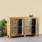 Side angle image with open doors of a Aashish-hand-painted-sideboard-reclaimed-wood-150cm with floral design.