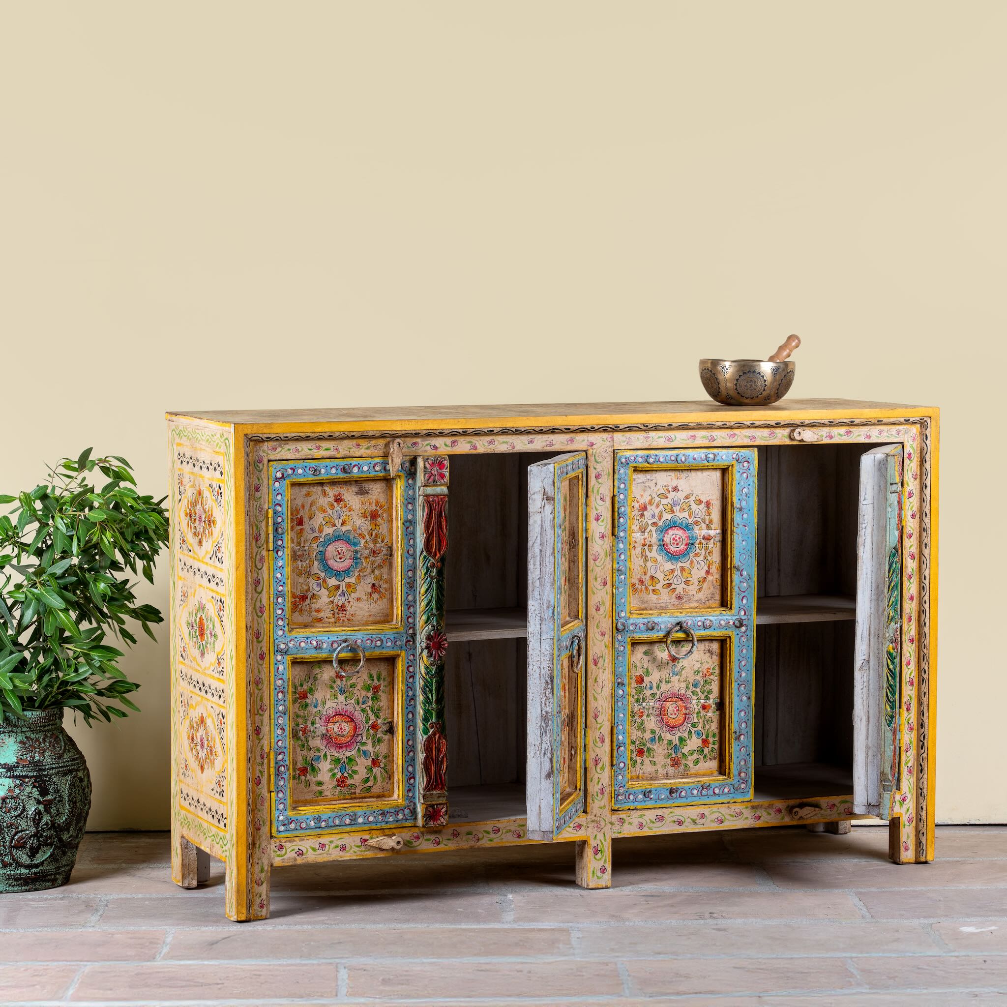 Side angle image with open doors of a Aashish-hand-painted-sideboard-reclaimed-wood-150cm with floral design.