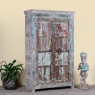 Side angle image of a antique Indian Door Wardrobe with generated colours and iron fittings in vintage style made of teak wood.