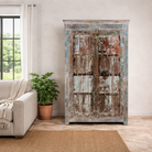 Lifestyle image of a antique Indian Door Wardrobe with generated colours and iron fittings in vintage style made of teak wood.