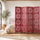 Lifestyle image of a hand-carved pink mango wood folding room divider with delicate carved patterns, natural variations, and warm boho style for unique interiors.