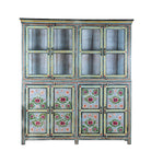 White background image of a large hand painted, 2 parts, Mango wood display cabinet wit 8 doors and ample inside storage in vintage design.