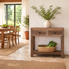 Lifestyle image of a reclaimed wood console table with 2 drawers and one shelf in driftwood style.