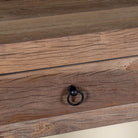 Close up image of a reclaimed wood console table with 2 drawers and one shelf in driftwood style.