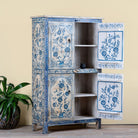Side angle image with open doors of a unique hand painted wardrobe made of reclaimed wood with floral design, 4 doors and ample storage.