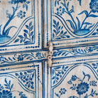 Close up image of a unique hand painted wardrobe made of reclaimed wood with floral design, 4 doors and ample storage.