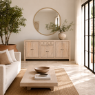 Lifestyle image of a sandblasted wooden sideboard with three compartments and two small drawers, Ibiza style living room furniture in light natural finish, 200×40×90 cm.