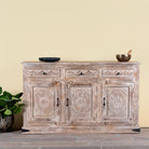 Abhiraj hand carved mango wood sideboard with distressed cream finish, three drawers and three doors, 150cm