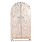 White background image of an arched wooden wardrobe made of mango wood with hand-carved floral details; hand carved wooden furniture in Ibiza style, 190 × 100 × 40 cm.