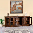 Open door image of a reclaimed teak furniture sideboard with glass doors, rustic living room furniture with boho style, 257 × 46 × 100 cm.