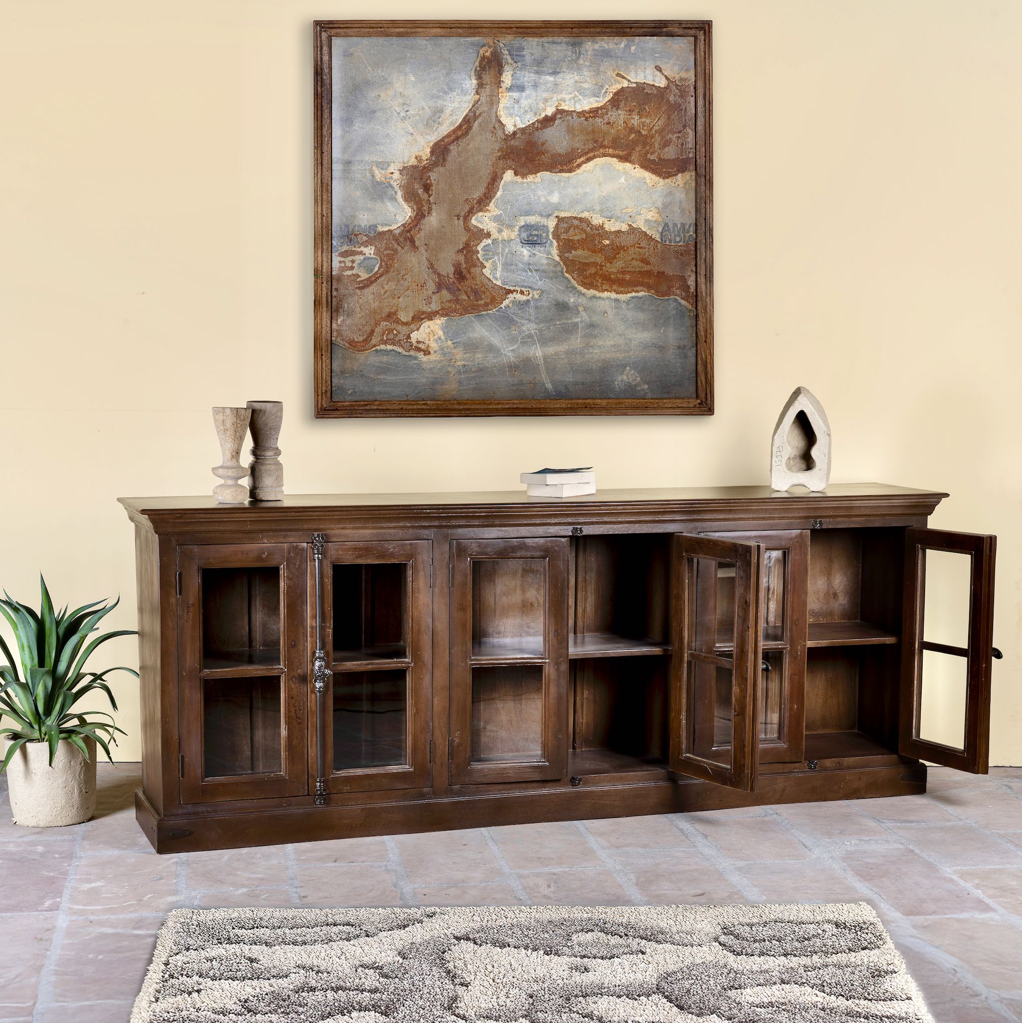 Open door image of a reclaimed teak furniture sideboard with glass doors, rustic living room furniture with boho style, 257 × 46 × 100 cm.