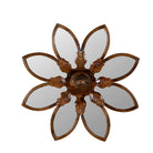 White background image of a round mango wood mirror Advaith with hand-carved floral frame. A unique wall decor piece combining traditional Indian craftsmanship and organic design.