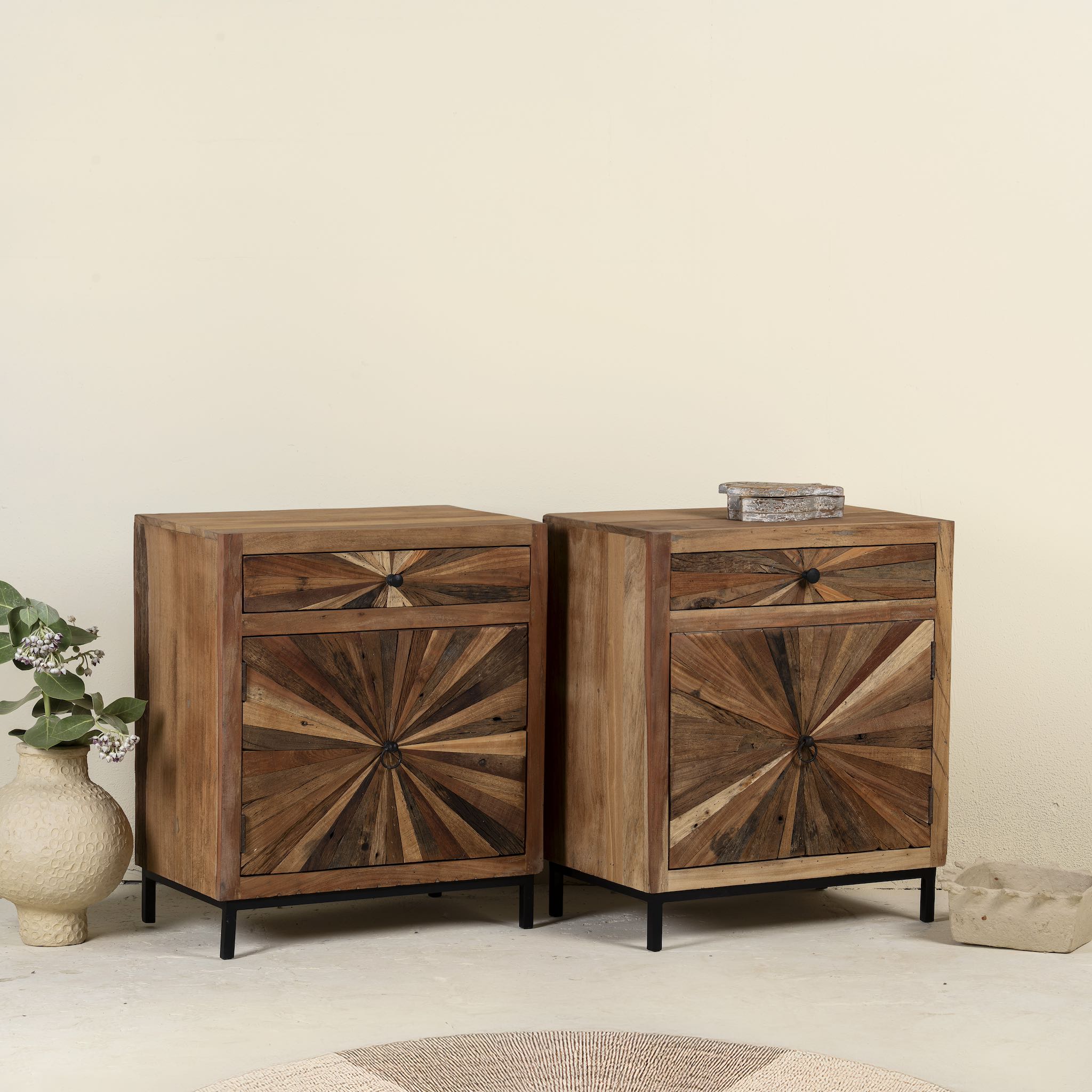 Side angle image of a driftwood cabinet with sunburst front pattern and iron legs, one drawer and cabinet; looks great as sink base cabinet or accent furniture, 63 × 40 × 73 cm.
