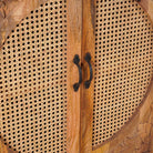 Close up image of the rattan inserts of handcrafted mango wood cabinet Agnayi with rattan inserts and floral carvings, rattan furniture for bohemian interior, 80 × 40 × 148 cm.