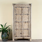 Reclaimed teak wood cabinet Ahara with Mediterranean design, featuring hand-carved antique Indian doors and metal accents. A unique piece of old door furniture ideal for stylish, character-rich living room storage.
