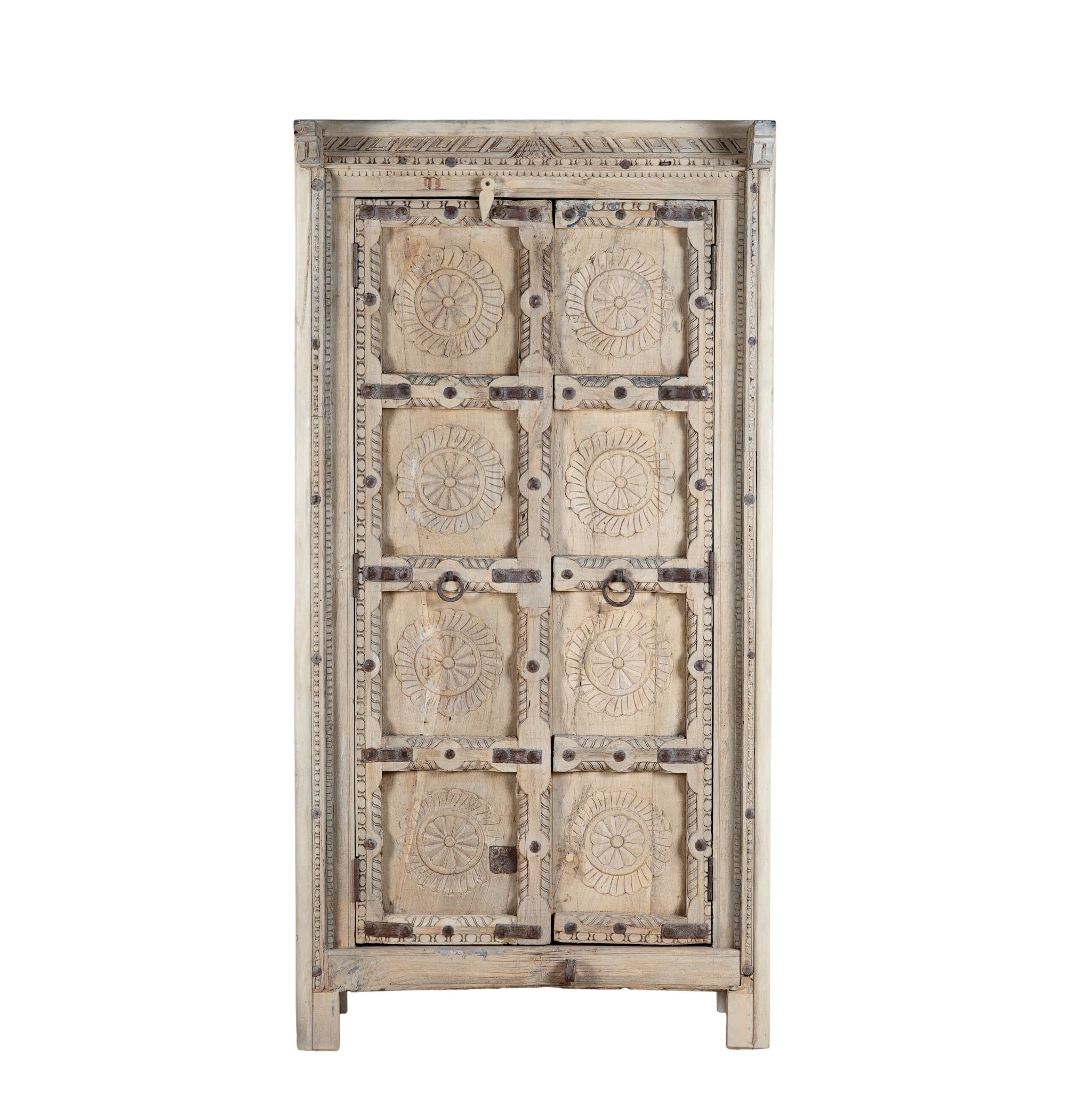 White background image of a reclaimed teak wood cabinet Ahara with Mediterranean design, featuring hand-carved antique Indian doors and metal accents. A unique piece of old door furniture ideal for stylish, character-rich living room storage.