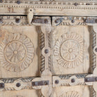 Close up image of a reclaimed teak wood cabinet Ahara with Mediterranean design, featuring hand-carved antique Indian doors and metal accents. A unique piece of old door furniture ideal for stylish, character-rich living room storage.