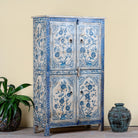 Side angle image of a unique hand painted wardrobe made of reclaimed wood with floral design, 4 doors and ample storage.