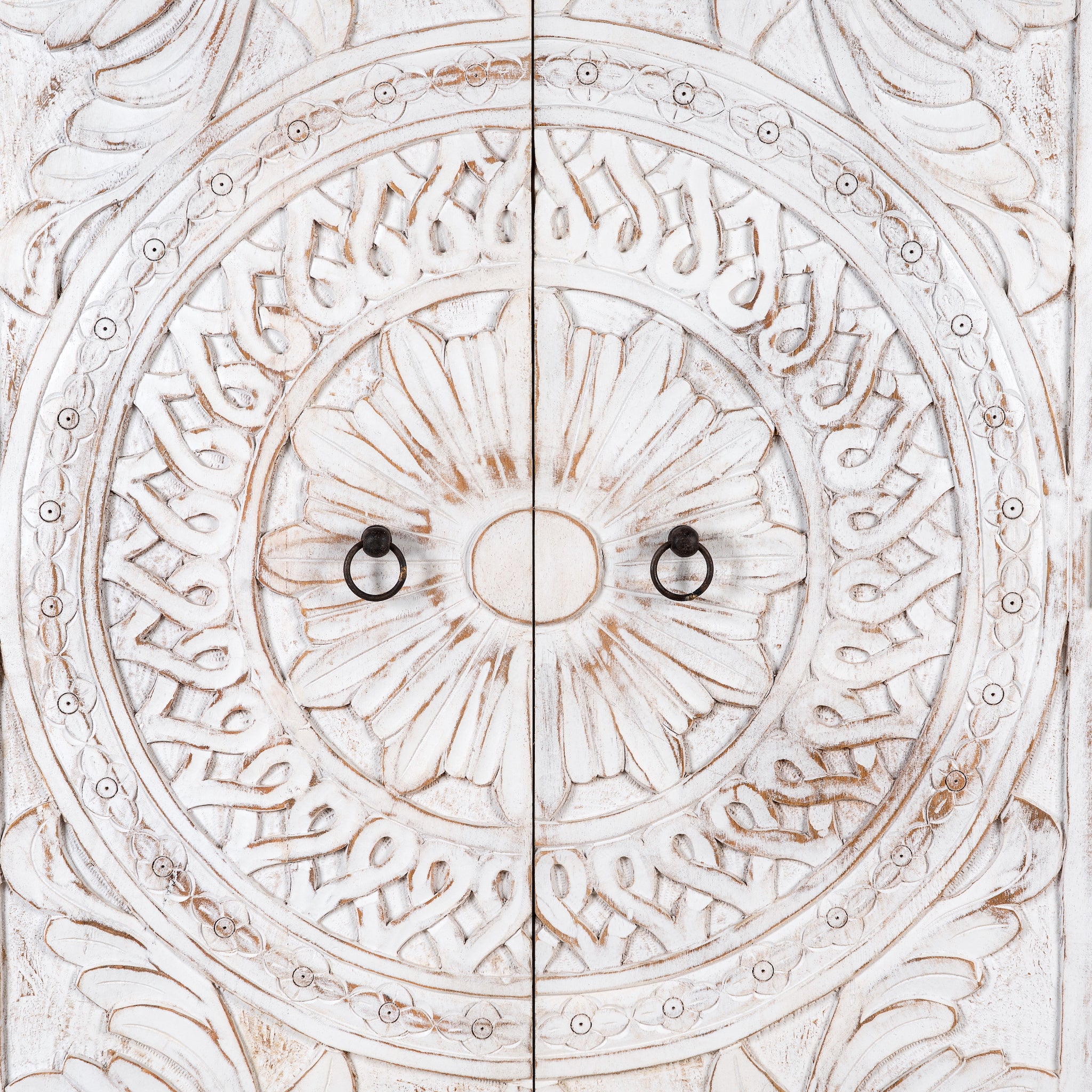 Close up image of an Aila handcrafted solid mango wood wardrobe with intricately hand-carved Indian doors, four spacious storage compartments, natural wood grain, and Mediterranean-inspired design, 180cm.