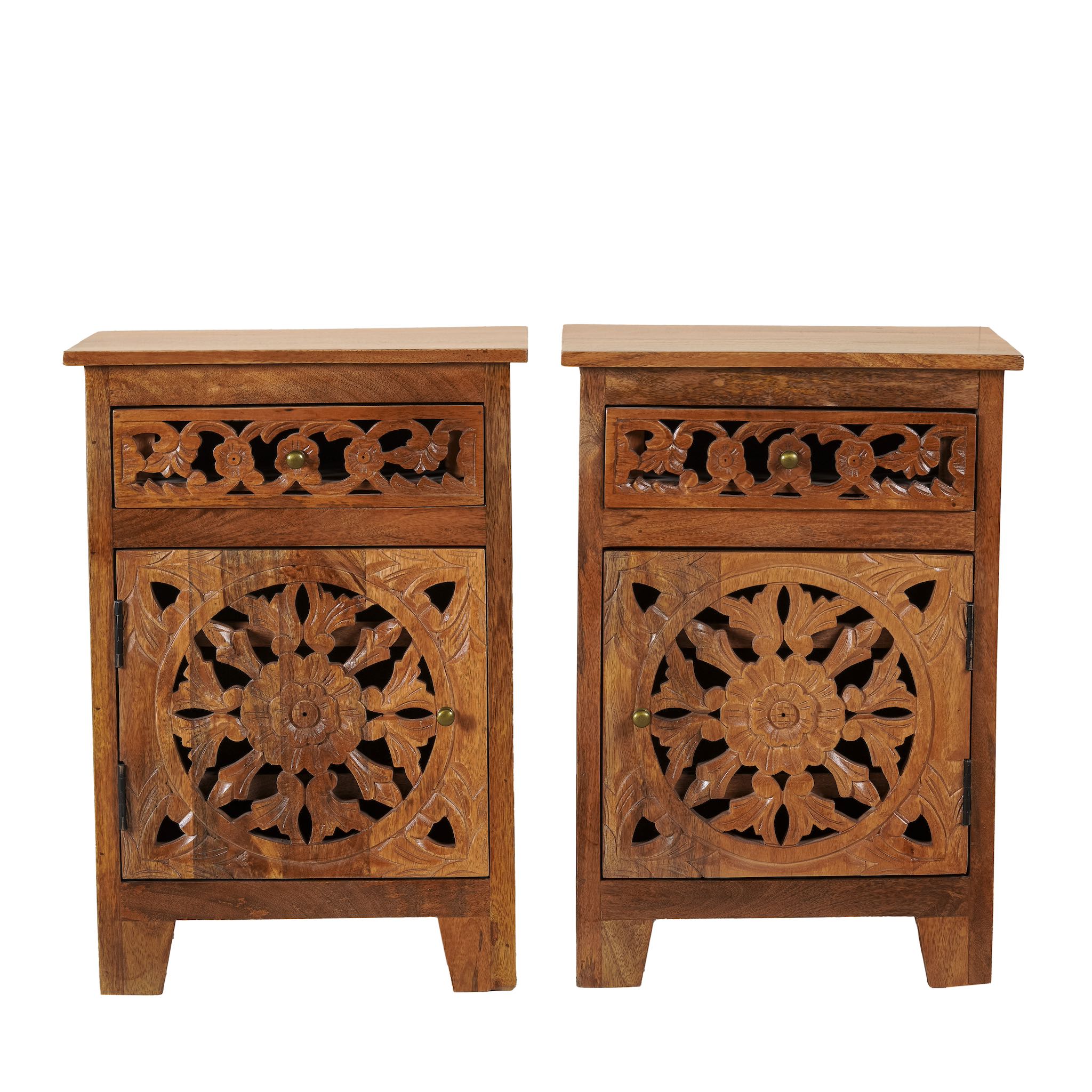 White background image of a pair of mango wood night stands with hand carved floral and geometric detailing, warm teak finish; elegant hand carved furniture, 45 × 35 × 65 cm.