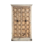White background image of a reclaimed wood wardrobe Akhila featuring an old Indian door front with carved details and iron hardware. A sustainable furniture piece and unique old door cabinet for soulful, heritage-inspired interiors.