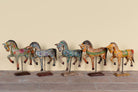 Aksham hand painted wooden horse sculpture on an iron stand with colourful floral and ornamental detailing, 40x15x30cm.