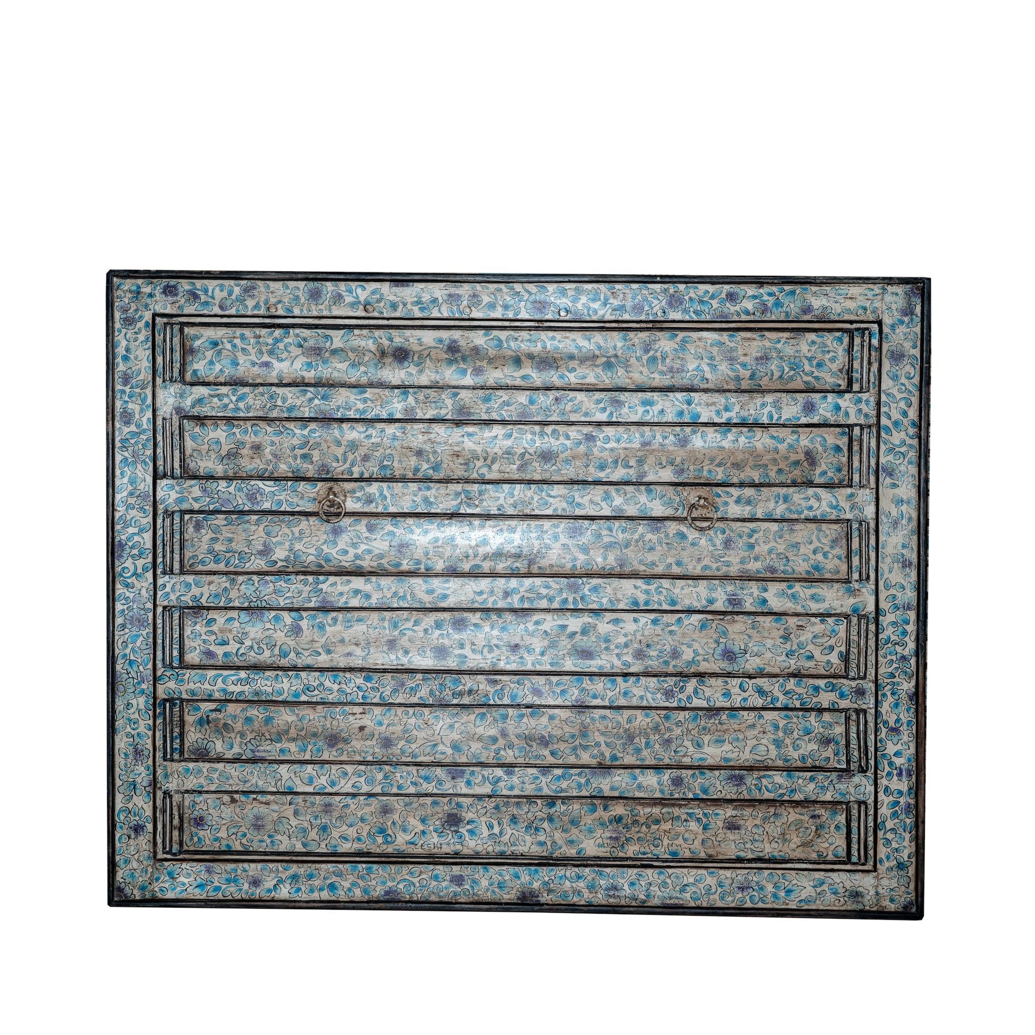 White background image of a Akshi hand painted head board made from an antique Indian teak door, featuring traditional floral motifs in blue and cream and original iron hardware—an elegant example of hand painted head boards and authentic Indian headboards.