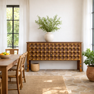 Lifestyle image of a antique door console table handcrafted from reclaimed teak wood with original paint; teak wood console, 180 × 90 × 43 cm.
