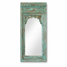 White background image of a hand carved wooden mirror made from antique Indian window frame, vintage green finish; 145 × 70 × 10 cm.