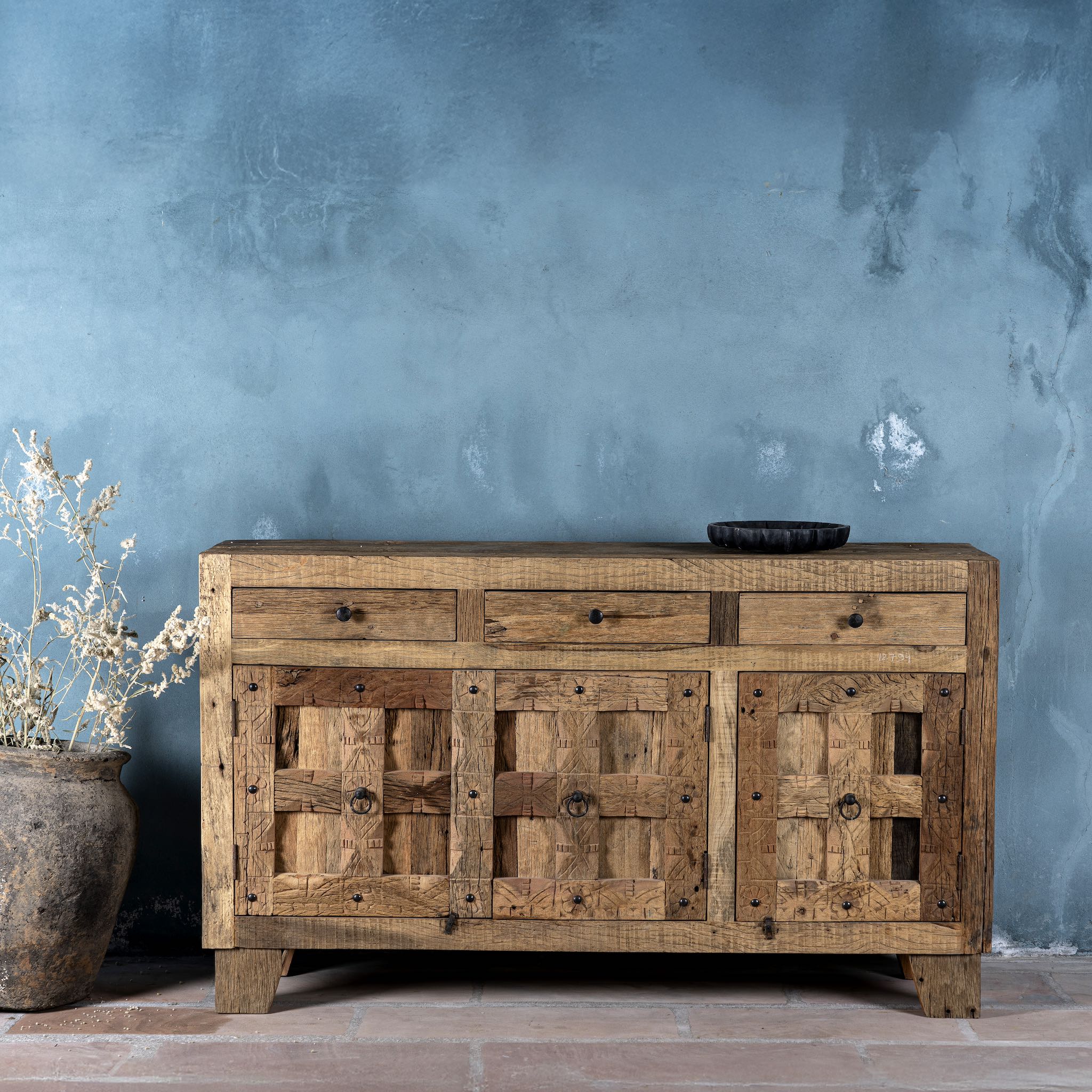 Front view of a rustic design sideboard made from reclaimed wood with panelled doors, drawers, and iron accents; 150 × 40 × 90 cm.