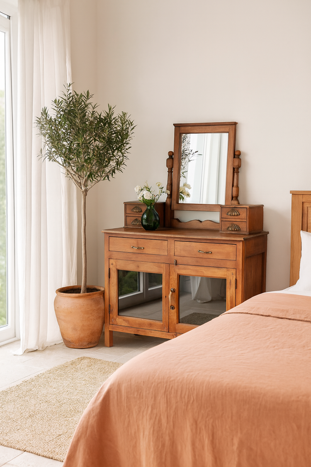 Lifestyle imagination of a restored antique cosmetic table in teak wood with hand-carved details; teak wood furniture for bohemian interiors, 105 × 56 × 148 cm.