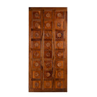 Wooden door with intricate carvings on a white background
