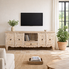 Lifestyle image of a hand-carved traditional sideboard made from mango wood with whitewashed floral detailing; perfect as entryway table vintage or TV unit, 198 × 82 × 40 cm.