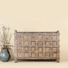 Unique Indian furniture teak counter table with vintage shelving and aged green paint, antique console with original wood panel detailing, 152 × 64 × 102 cm.